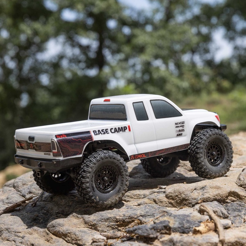 SCX24 Basecamp crawling on rocks showing tire grip and terrain interaction